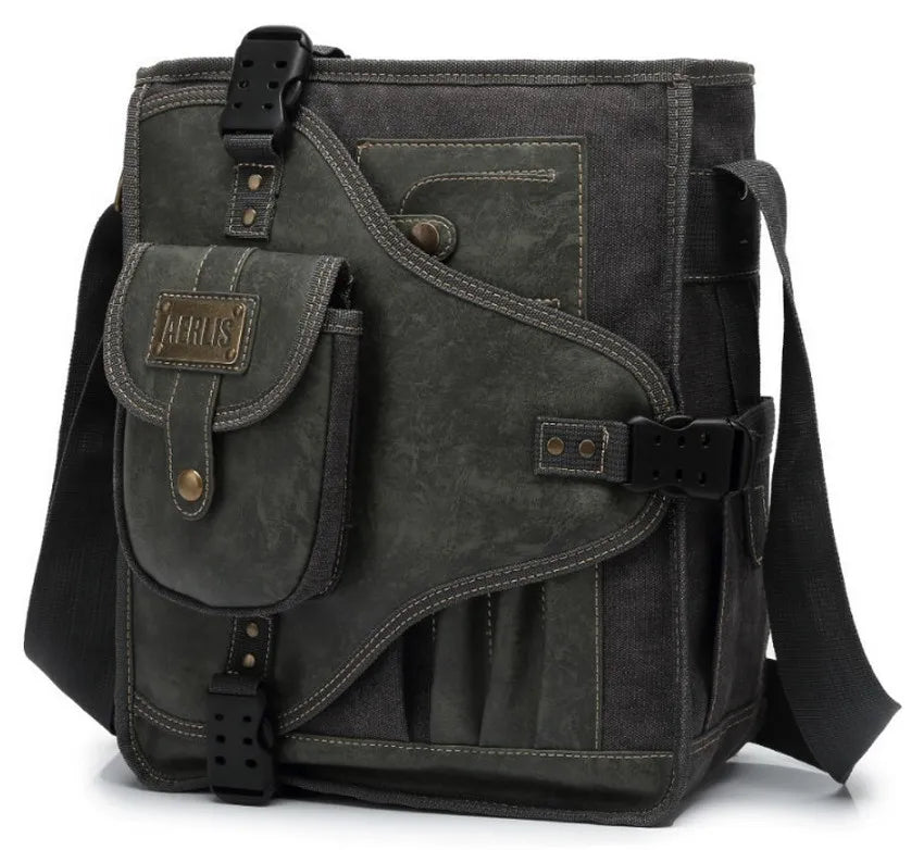 Sac bandoulière homme AERLIS en toile noire avec finitions contrastées, poche frontale à rabat, boucle sécurisée et design urbain robuste.