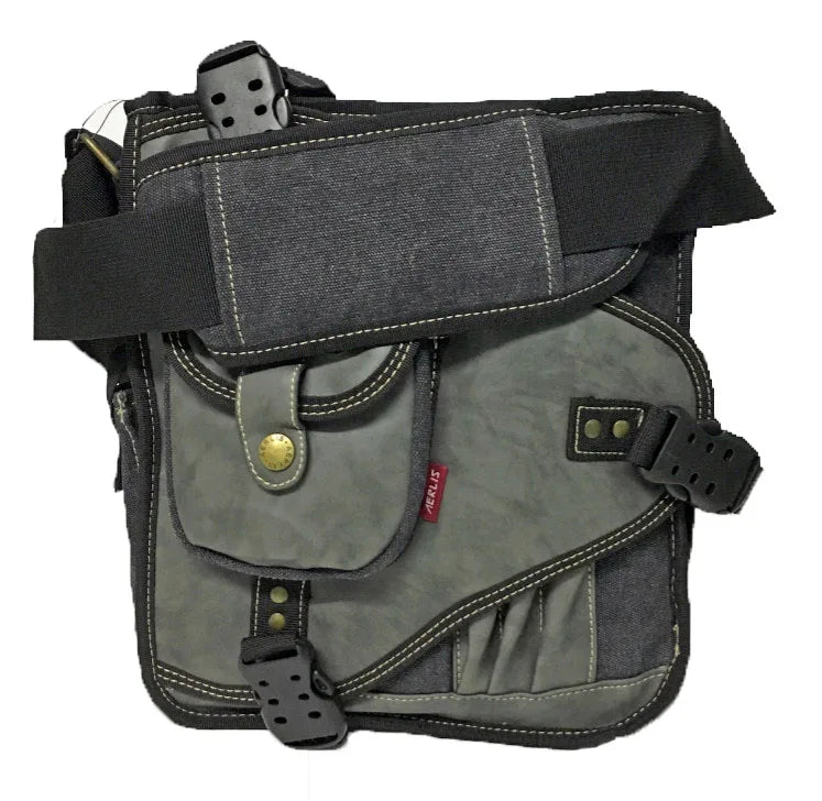 Sac bandoulière AERLIS gris foncé avec sangle noire renforcée, rabat en cuir synthétique, poche frontale à bouton pression doré et finitions contrastantes.
