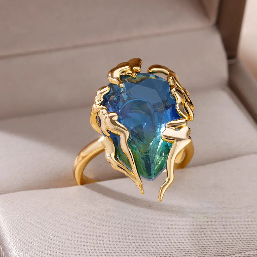 Bague goutte de zircon bleue – Motif feu plaqué or.